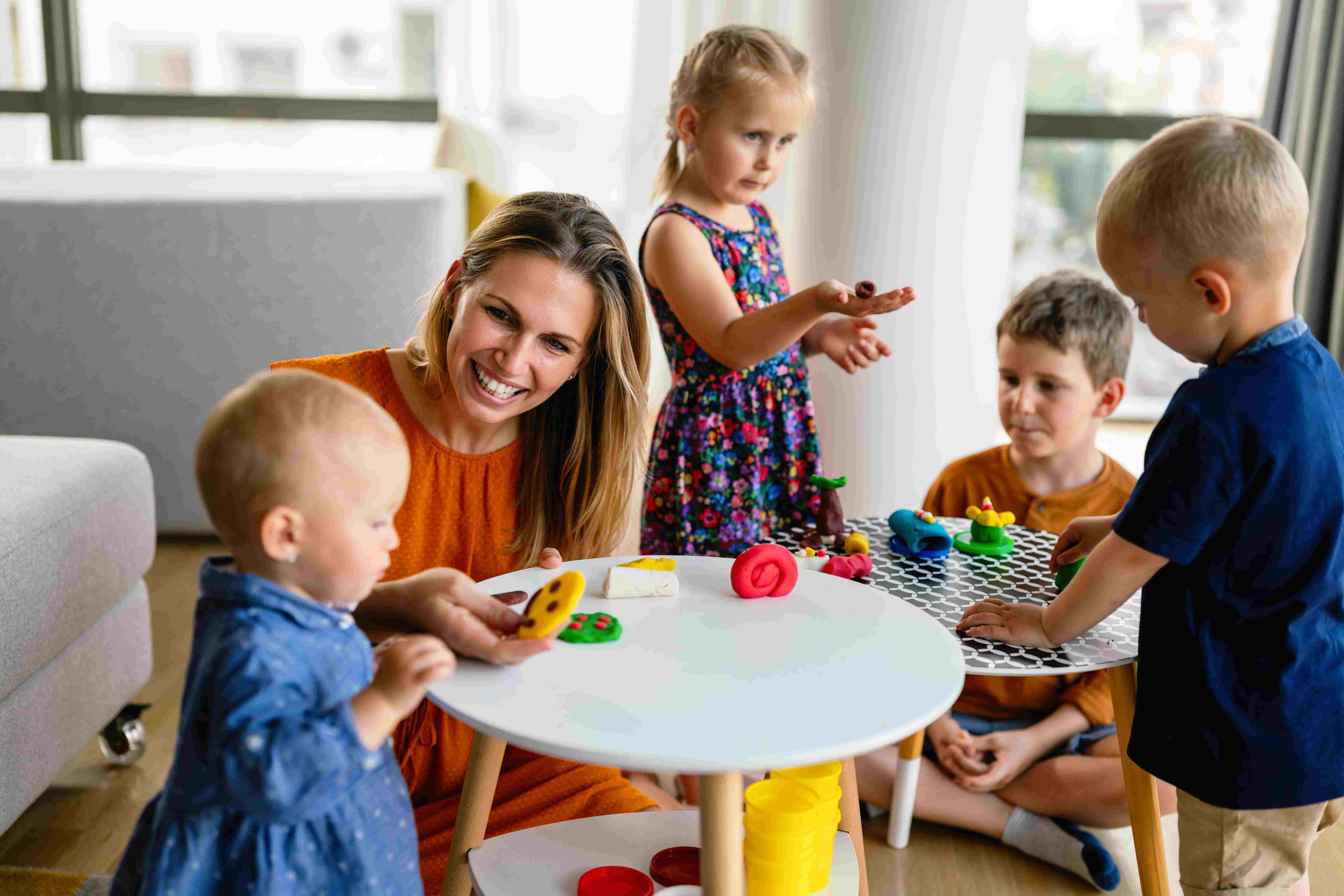 Children experiencing a Calm Transition at childcare with a teacher through play activities